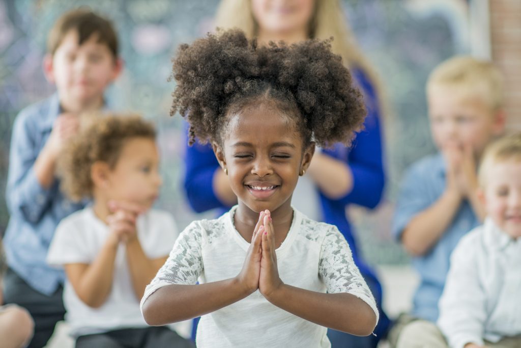 School child praying
